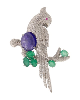 Lot 124 - A silver tanzanite, emerald, diamond, and ruby eye set cockatoo parrot brooch/pendant.