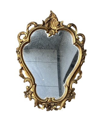Lot 69 - A French Rococo-style wall mirror with an...