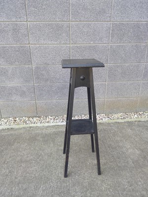 Lot 47 - An Ebonised Plant Stand. The Stand is 85cm...