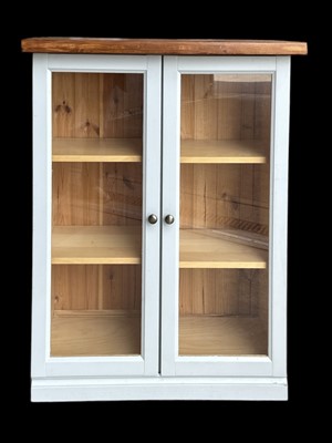 Lot 4 - A Glazed Wooden Cupboard. The measurements are...