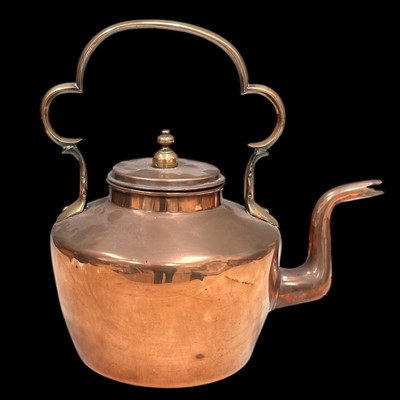 Lot 151 - A heavy brass and copper kettle, 29cm overall...