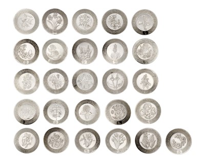 Lot 136 - A collection of modern silver miniature alphabet flower plates, on an oak wall rack.