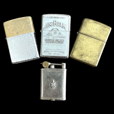 Lot 166 - Three Zippo lighters and a Gem lighter.