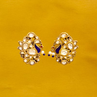 Lot 46 - A pair of traditional Indian high-purity gold, white sapphire, pearl, and enamel peacock earrings.