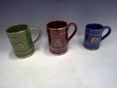 Lot 179 - Three Denby Commemoration Mugs.