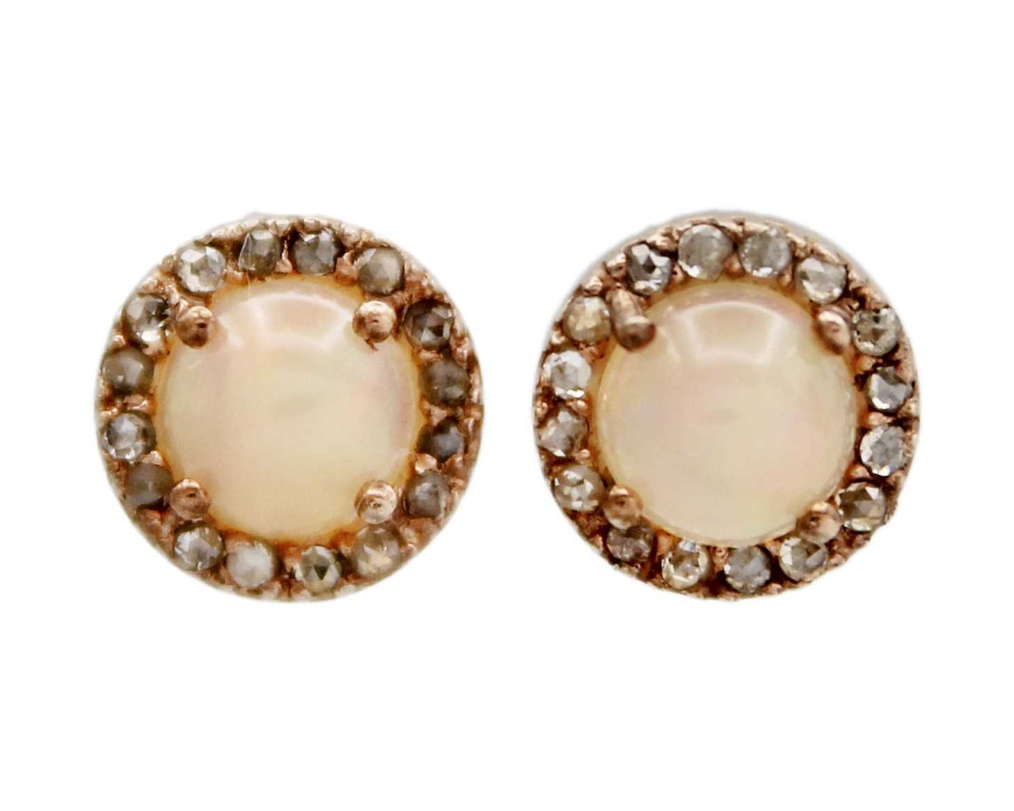 Lot 3 - A pair of silver gilt opal and diamond stud earrings.