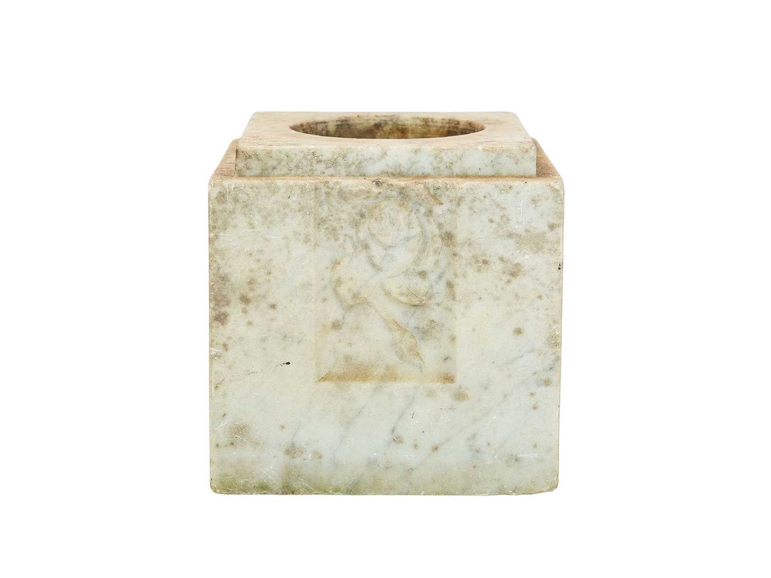 Lot 21 - A marble block vase with carved rose decoration.