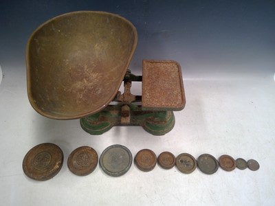 Lot 198 - A Cast Iron set of Scales and Graduated Weights.