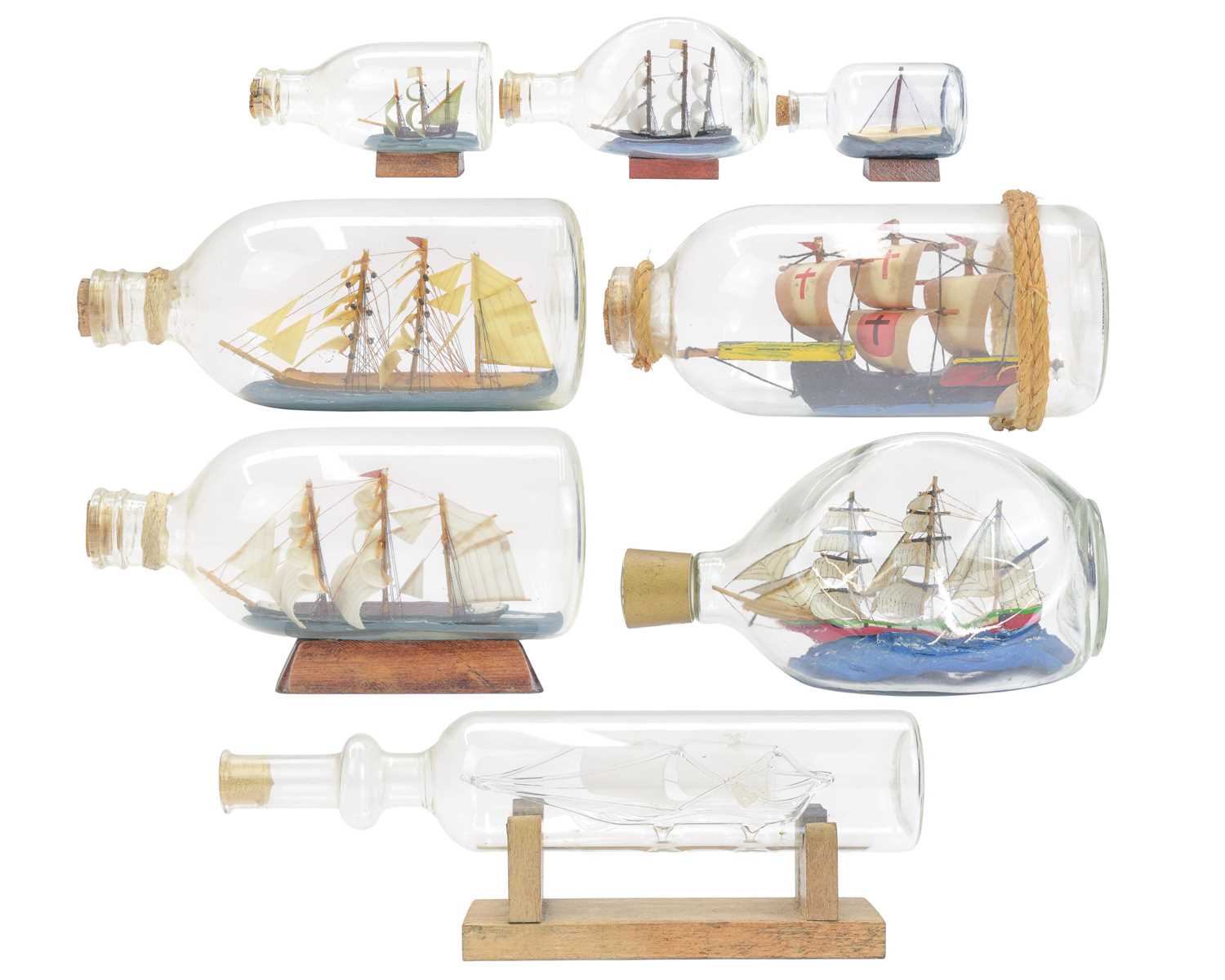 Lot 12 - Eight ships in bottles.