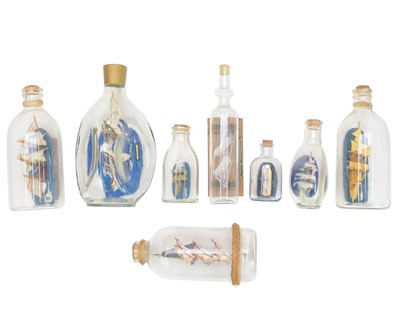 Lot 12 - Eight ships in bottles.