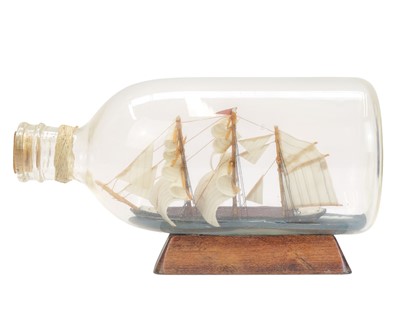 Lot 12 - Eight ships in bottles.