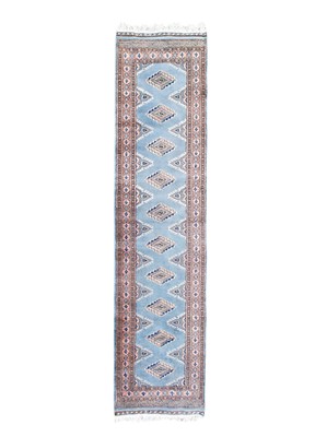 Lot 444 - A blue ground Bokhara wool runner.