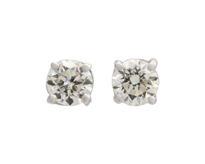 Lot 64 - A pair of 18k white gold diamond solitaire stud earrings.