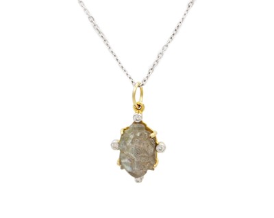 Lot 91 - A 14k gold Labradorite carved Buddha pendant on a silver cable chain.