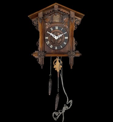 Lot 62 - A Black Forest cuckoo clock, the cuckoo is...