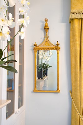 Lot 841 - A pair of giltwood and verre eglomise mirrors or pier glasses.