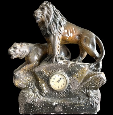Lot 67 - A painted plaster table/mantel clock in the...