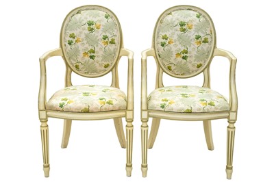 Lot 936 - A pair of Adam style painted elbow chairs.