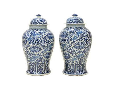 Lot 425 - A pair of Chinese large blue and white temple vases and covers.
