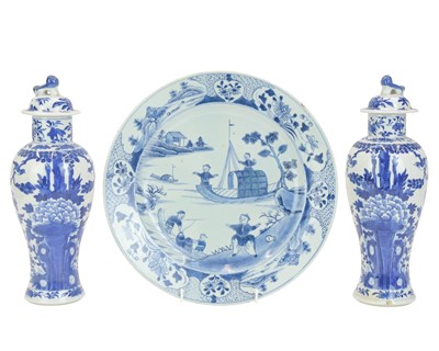 Lot 424 - A pair of Chinese blue and white baluster vases and covers.