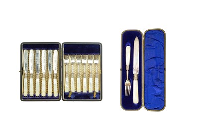Lot 206 - A cased set of six mother-of-pearl and silver dessert knives and forks.