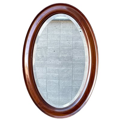 Lot 119 - An Oval Mahogany bevelled-edge Mirror. 54 x 82cm.