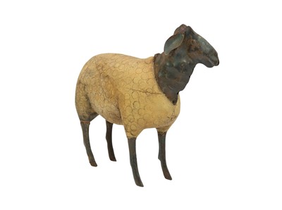 Lot 285 - A folk art carved wood sheep.