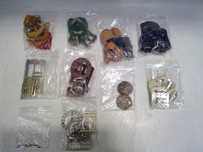 Lot 76 - A collection of belt buckles in a variety of...