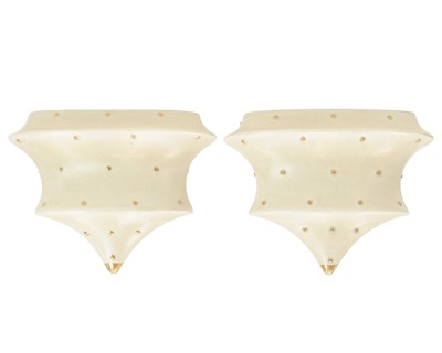 Lot 684 - A pair of Charlotte Rhead Bursley Ware wall pockets.