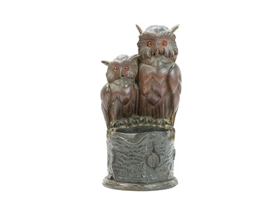 Lot 306 - A Black Forest carved treen owl pot holder.