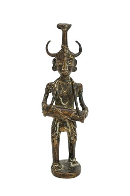 Lot 133 - An Indian cast bronze figure of a musician.