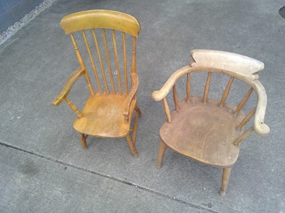Lot 142 - A Captain's Chair and a High Stick Back Chair.