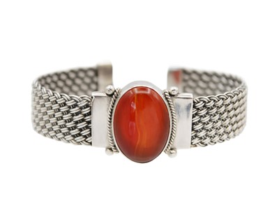 Lot 82 - A silver with carnelian woven open bangle.
