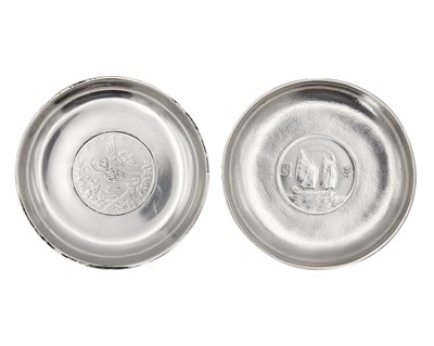 Lot 163 - Two silver coin inset pin dishes.