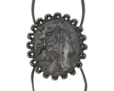 Lot 70 - A jet cameo buckle.