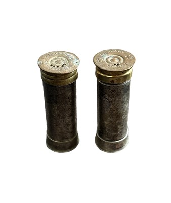 Lot 146 - A pair of salt and pepper shakers in the form...