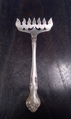 Lot 157 - An American, Sterling Silver Sardine Fork. The...