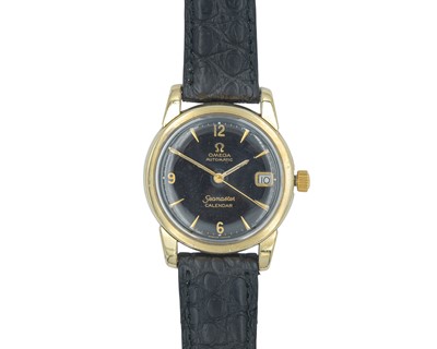 Lot 1042 - OMEGA - A Seamaster automatic gold-capped gentleman's calendar wristwatch.