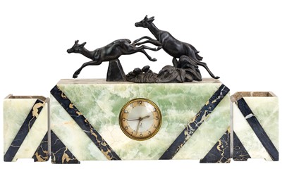 Lot 654 - An Art Deco marble and onyx three piece clock garniture.