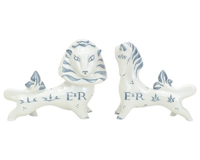 Lot 691 - A pair of Richard Parkinson Pottery Lion and Unicorn figures.