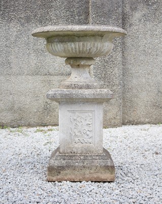 Lot 765 - A large composition stone garden urn.
