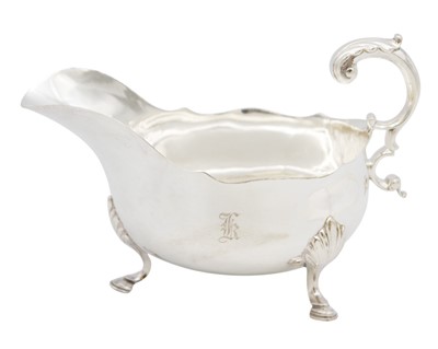 Lot 186 - An Edwardian silver gravy boat by Atkins Brothers.