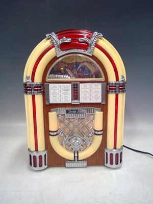 Lot 185 - A Retro Cassette Tape and Radio Jukebox. The...