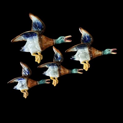 Lot 65 - A set of vintage ceramic flying ducks, the...