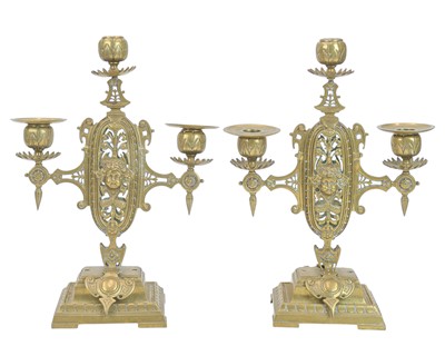 Lot 160 - A pair of three-branch brass candleabra.