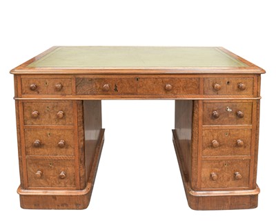 Lot 909 - A Victorian figured walnut twin pedestal writing desk.
