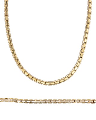 Lot 82 - An 18k two-tone yellow gold necklace and bracelet set, boxed.