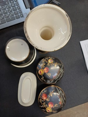 Lot 48 - A Victorian ironstone vase of hexagonal form, together with a pair of matching smaller vases.