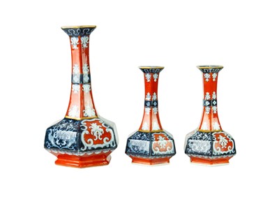 Lot 48 - A Victorian ironstone vase of hexagonal form, together with a pair of matching smaller vases.