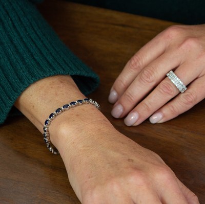 Lot 215 - A 14k white gold sapphire and diamond bracelet.